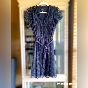 Black dress with small white polka dots.